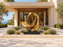 Abstract bronze sculpture displayed in a European luxury hotel courtyard