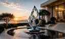 Luxury architectural space featuring a contemporary stainless steel sculpture as a visual centerpiece for modern outdoor design
