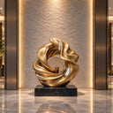 With an intertwining ribbon design, this flowing bronze sculpture functions as contemporary entrance artwork for modern commercial foyers.
