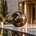Abstract bronze sphere sculpture BB-013 displayed beside the pool entrance of a contemporary luxury villa