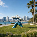 Abstract fiberglass deer sculpture installed in a modern outdoor landscape with natural surroundings and contemporary design