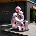 Abstract stainless steel human sculpture with pearl painted finish displayed in a modern public art space