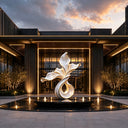 Abstract stainless steel sculpture with organic geometric design and polished metal finish for contemporary luxury interior spaces