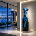 Blue fiberglass female sculpture displayed in a modern luxury residence with contemporary architectural interior design