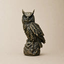 Modern bronze owl sculpture on white background