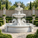 Classical white marble water fountain featuring carved horse statues and shell details, set in an elegant garden courtyard with stone walls and manicured hedges, perfect for luxury outdoor patio decor.