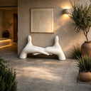Contemporary abstract fiberglass sculpture with organic fluid form and smooth painted finish for luxury interior and architectural spaces