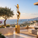 Overlooking a seaside courtyard, this bronze butterfly woman statue anchors a moment of graceful motion, crafted as a bespoke contemporary artwork.