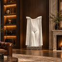 Hewn from a single block, this contemporary marble veil sculpture presents a surreal figurative form, integrated into an exclusive residential interior.