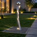 Installed on a manicured lawn, this contemporary metal garden sculpture is crowned with a stainless steel orb, providing a minimalist accent for an outdoor corporate landscape.

