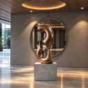 A continuous cast bronze sculpture featuring two asymmetric negative spaces and a smooth organic silhouette, mounted on a stone pedestal within a modern luxury interior.