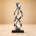 Documenting the detailed craftsmanship, this custom metal landscape artwork demonstrates a highly reflective metallic sheen against a neutral backdrop for stainless steel corporate sculpture catalogs.