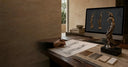 Bronze female sculpture with a design sketch and concept model in a sculptor’s studio”