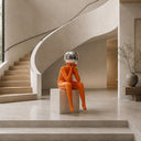 Contemporary fiberglass human form sculpture displayed in a luxury interior environment