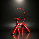 Close-up detail of glossy fiberglass cat sculpture showing smooth polished surface and handcrafted finish