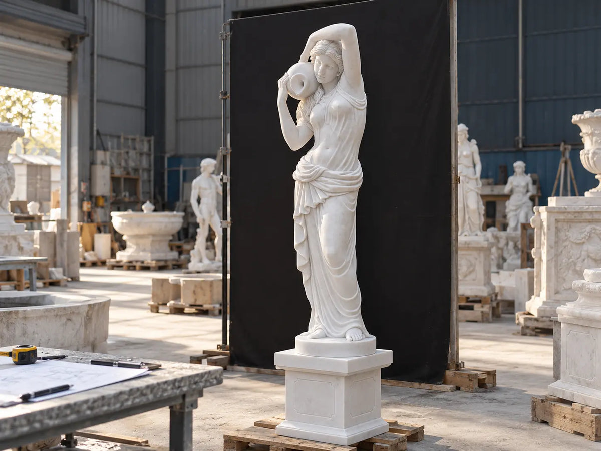 Undergoing finishing and quality review, this carved marble statue stands in the workshop, serving as the final check before packing.
