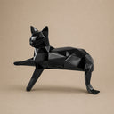 Close-up view of geometric cat sculpture showing faceted surfaces and polished stainless steel craftsmanship details