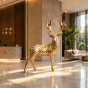 Geometric stainless steel deer sculpture displayed in a luxury hotel and architectural space, creating a modern artistic focal point