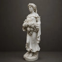 Black marble Goddess of Harvest sculpture isolated on white background