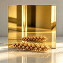 Gold mirror polished stainless steel sculpture finish sample showing reflective PVD surface options for luxury architectural artwork