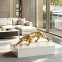 Gold stainless steel leopard sculpture with contemporary spotted design