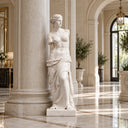 Greek style white marble female statue placed in an arched corridor with natural light, showcasing elegant interior decor for high-end residential and commercial spaces.