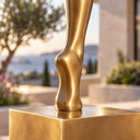 Zooming into the hand-sculpted bronze butterfly, this close-up spotlights the textured wing veins and the reflective metallic patina of the sculpture.
