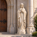Positioned at a sanctuary entrance, this Immaculate Conception marble statue reveals the hand-carved details of the praying Madonna.

