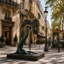 Large surrealist bronze sculpture displayed as public art in an American street environment with urban architecture