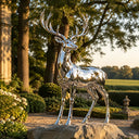 Mirror polished stainless steel deer sculpture SS-021 displayed in a luxury garden landscape with modern outdoor architectural design