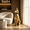 Gold stainless steel dog sculpture SS-024 displayed in a luxury modern interior with contemporary architectural design