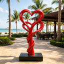 Red painted stainless steel heart sculpture installed in luxury resort landscape space SS-018