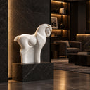 Defined by smooth, abstract curves, this modern equestrian sculpture in white marble serves as a refined accent for upscale interior spaces.