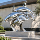 Mirror polished stainless steel double dolphin sculpture featuring two intertwined flowing marine forms