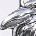 Mirror polished stainless steel double dolphin sculpture with intertwined flowing forms displayed on a pedestal