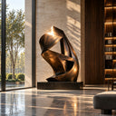 Modern abstract bronze sculpture BB-014 with geometric ribbon forms displayed in a contemporary luxury interior