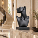 Representing aspiration and modern artistry, this matte black female bust is tailored for modern interiors, such as an elegant staircase hallway.