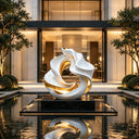 Organic abstract stainless steel sculpture displayed in a luxury interior space with elegant architecture and contemporary design