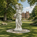 Situated on a manicured lawn, this outdoor marble Demeter statue illustrates classical female grace, offering a custom marble garden sculpture for traditional estates.