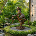 Patina bronze female figure sculpture installed in a luxury garden landscape