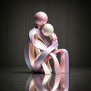 Close-up view of pearl painted stainless steel sculpture showing smooth curves and refined finish