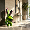 Showcasing a vibrant cosmic animal aesthetic, this pop art fiberglass bunny statue is positioned within a contemporary home gallery or modern living space.