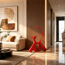 Red fiberglass cat sculpture displayed in a luxury modern living room with elegant architectural interior design
