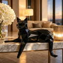 Polished stainless steel cat sculpture displayed in a luxury lobby interior, creating a modern artistic focal point