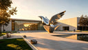 Custom stainless steel sculpture displayed in a modern architectural space