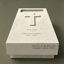 Photographed in front of a dark studio backdrop, this warm beige granite memorial stone with an engraved cross and epitaph is presented for cemetery monument catalogs.