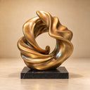 Formed in solid bronze, this custom cast sculpture accentuates the organic, looping aesthetics of the ribbon motif against a studio backdrop.