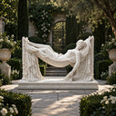 White marble reclining woman in hammock statue MM-026 displayed in a landscaped luxury garden