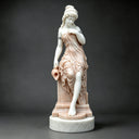 Angled view of white marble woman with amphora statue MM-027 showing the carved drapery and integrated base