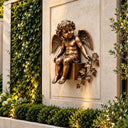 Winged angel statue wall-mounted on a lush green plant wall, blending with natural surroundings, ideal for villa gardens, courtyard walls, and outdoor wall decoration to create a peaceful and elegant atmosphere.